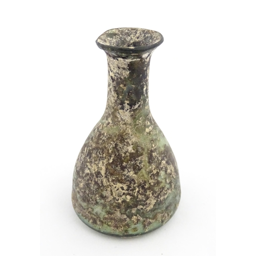 261 - A Roman glass flask with elongated neck and conical body. Approx. 2 3/4