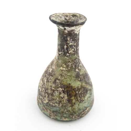 261 - A Roman glass flask with elongated neck and conical body. Approx. 2 3/4