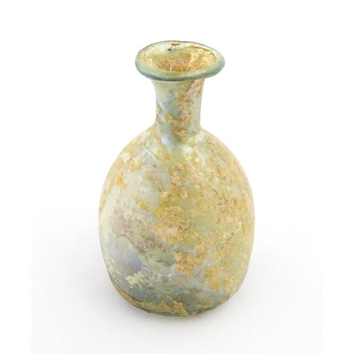 263 - A Roman glass flask with flared rim. Approx. 2 3/4