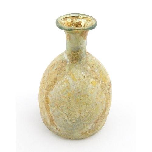 263 - A Roman glass flask with flared rim. Approx. 2 3/4