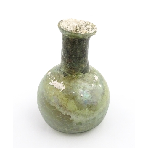 264 - A Roman glass flask with spherical body and cylindrical neck. Approx. 2 1/2