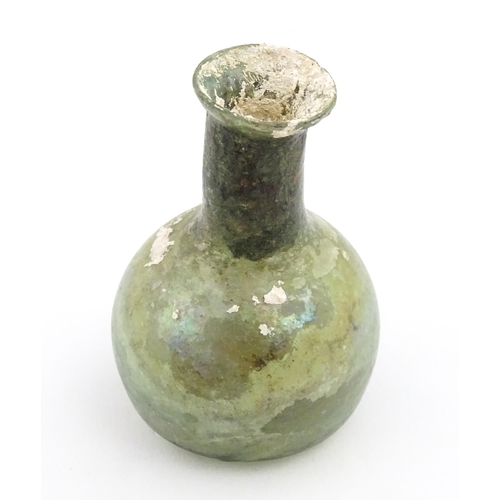 264 - A Roman glass flask with spherical body and cylindrical neck. Approx. 2 1/2