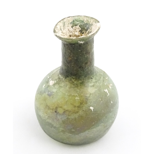 264 - A Roman glass flask with spherical body and cylindrical neck. Approx. 2 1/2