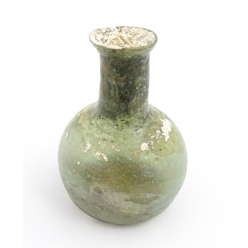 264 - A Roman glass flask with spherical body and cylindrical neck. Approx. 2 1/2