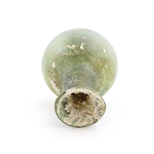 264 - A Roman glass flask with spherical body and cylindrical neck. Approx. 2 1/2