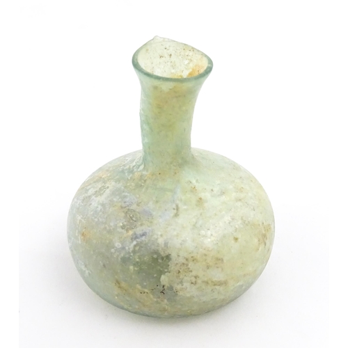 265 - A Roman glass flask with globular body and flared rim. Approx. 2 1/2