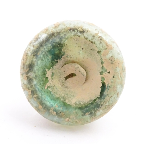 266 - A Roman glass flask with flared rim. Approx. 2 1/4