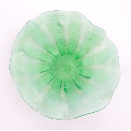 275 - A green and white art glass bowl with flared rim and controlled bubble detail. Approx. 9