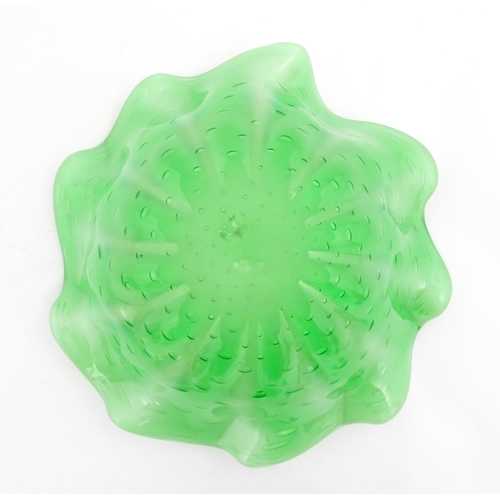 275 - A green and white art glass bowl with flared rim and controlled bubble detail. Approx. 9