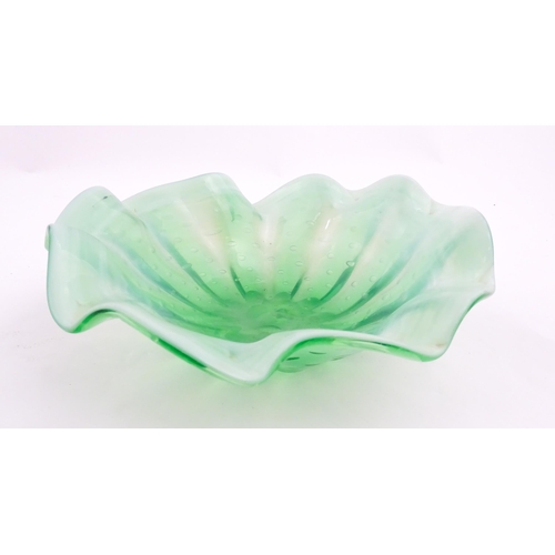 275 - A green and white art glass bowl with flared rim and controlled bubble detail. Approx. 9