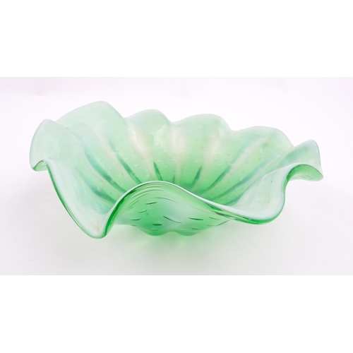 275 - A green and white art glass bowl with flared rim and controlled bubble detail. Approx. 9