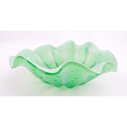 275 - A green and white art glass bowl with flared rim and controlled bubble detail. Approx. 9