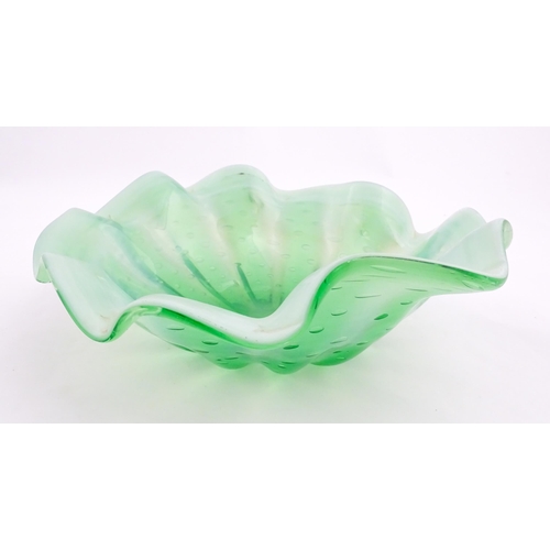 275 - A green and white art glass bowl with flared rim and controlled bubble detail. Approx. 9