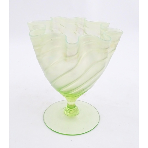 280 - A uranium glass pedestal vase with flared rim in the manner of John Walsh Walsh. Approx. 6