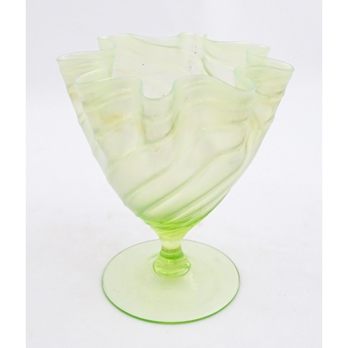 280 - A uranium glass pedestal vase with flared rim in the manner of John Walsh Walsh. Approx. 6