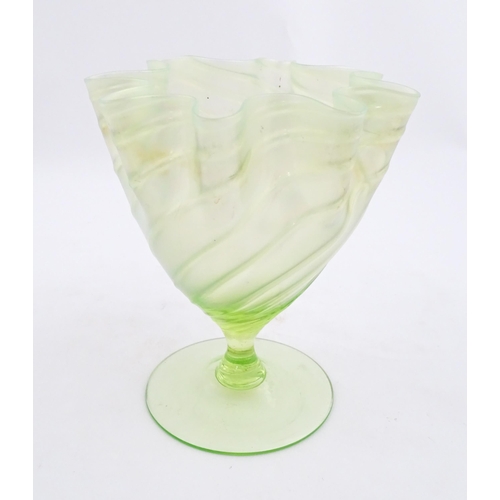 280 - A uranium glass pedestal vase with flared rim in the manner of John Walsh Walsh. Approx. 6