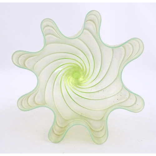 280 - A uranium glass pedestal vase with flared rim in the manner of John Walsh Walsh. Approx. 6