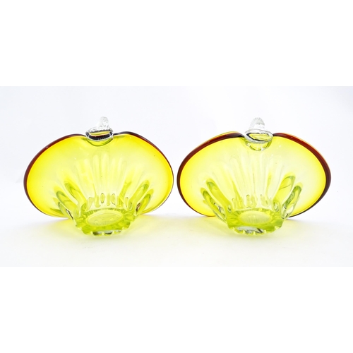 289 - A pair of yellow glass bon bon baskets with clear glass handle and red banded detail. Approx. 5 1/2