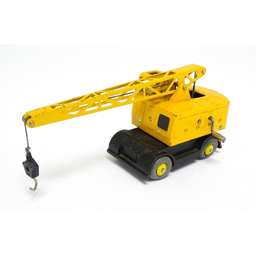 1165 - Toys: Two Dinky Supertoys die cast scale model vehicles comprising Coles Mobile Crane model no. 571,... 