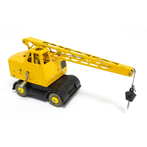 1165 - Toys: Two Dinky Supertoys die cast scale model vehicles comprising Coles Mobile Crane model no. 571,... 