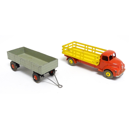 1166 - Toys: Three Dinky Supertoys die cast scale model vehicles comprising Dumper Truck model no. 562, Ley... 