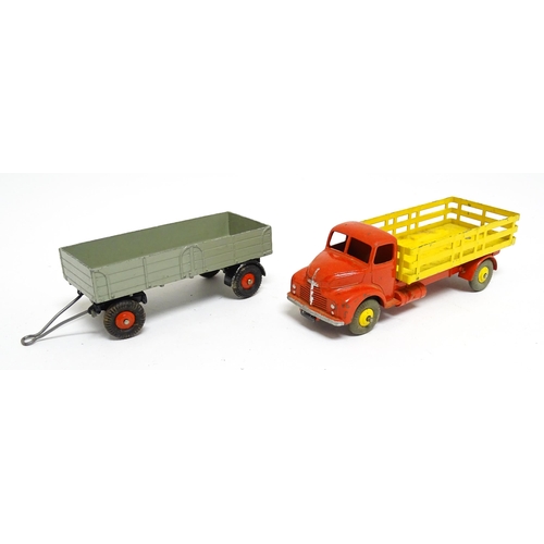 1166 - Toys: Three Dinky Supertoys die cast scale model vehicles comprising Dumper Truck model no. 562, Ley... 