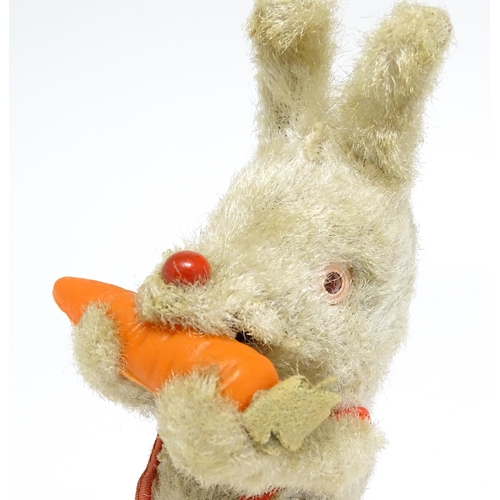 1170 - Toy: A 20thC clockwork / wind up 'Carrot Bunny', a bunny rabbit eating a carrot. Made in Japan. Appr... 