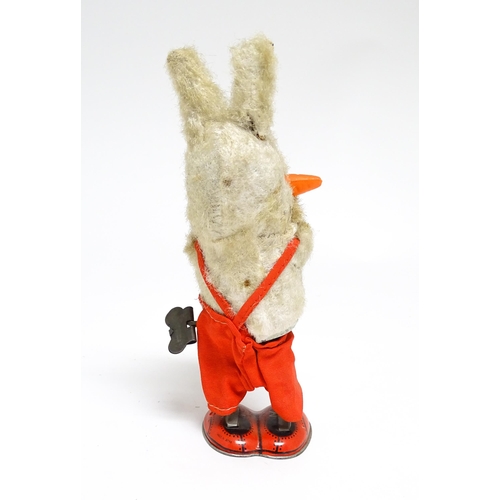 1170 - Toy: A 20thC clockwork / wind up 'Carrot Bunny', a bunny rabbit eating a carrot. Made in Japan. Appr... 