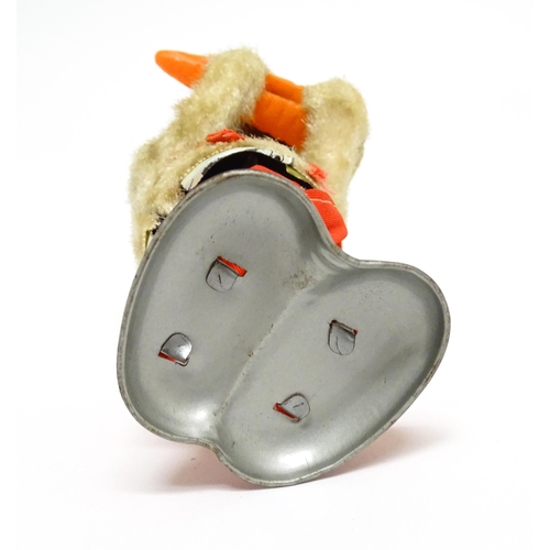 1170 - Toy: A 20thC clockwork / wind up 'Carrot Bunny', a bunny rabbit eating a carrot. Made in Japan. Appr... 