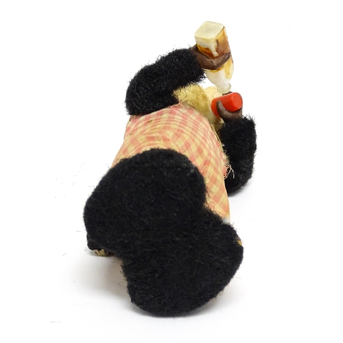 1170A - Toy: A 20thC clockwork / wind up 'Thirsty Bear', a panda bear with bottle and cup. Made in Japan. Ap... 