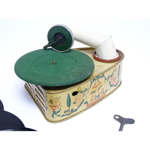 1174 - Toy: A 20thC German Bing tinplate clockwork Bingola 1 phonograph, together with assorted records. Ap... 