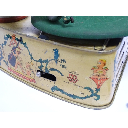 1174 - Toy: A 20thC German Bing tinplate clockwork Bingola 1 phonograph, together with assorted records. Ap... 