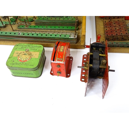 1181 - Toys: A quantity of assorted Meccano parts to include flat plates, girders, wheels, and tools. Withi... 