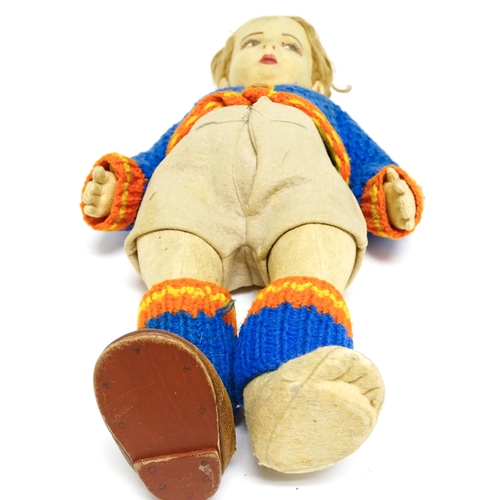 1182 - Toys: Four assorted 20thC toys to include an early 20thC Continental Lenci style felt cloth doll mod... 