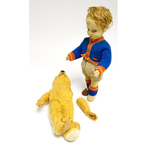 1182 - Toys: Four assorted 20thC toys to include an early 20thC Continental Lenci style felt cloth doll mod... 