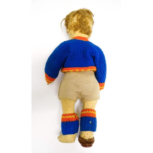 1182 - Toys: Four assorted 20thC toys to include an early 20thC Continental Lenci style felt cloth doll mod... 