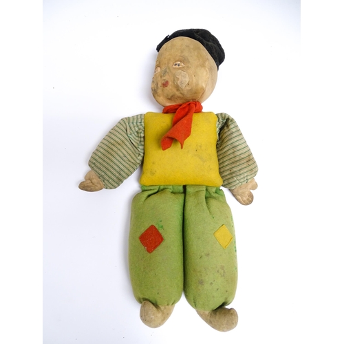 1182 - Toys: Four assorted 20thC toys to include an early 20thC Continental Lenci style felt cloth doll mod... 