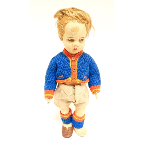 1182 - Toys: Four assorted 20thC toys to include an early 20thC Continental Lenci style felt cloth doll mod... 