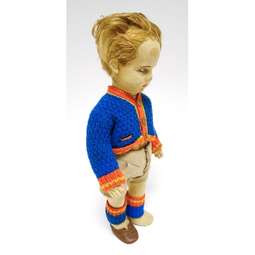 1182 - Toys: Four assorted 20thC toys to include an early 20thC Continental Lenci style felt cloth doll mod... 