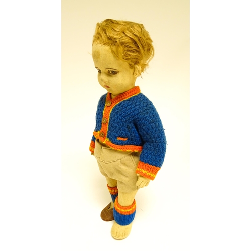 1182 - Toys: Four assorted 20thC toys to include an early 20thC Continental Lenci style felt cloth doll mod... 