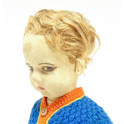 1182 - Toys: Four assorted 20thC toys to include an early 20thC Continental Lenci style felt cloth doll mod... 