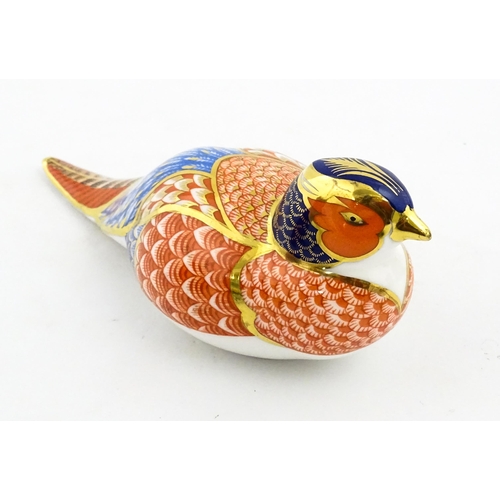 148 - A Royal Crown Derby paperweight modelled as a pheasant. Marked under, with gold stopper. Boxed. Appr... 