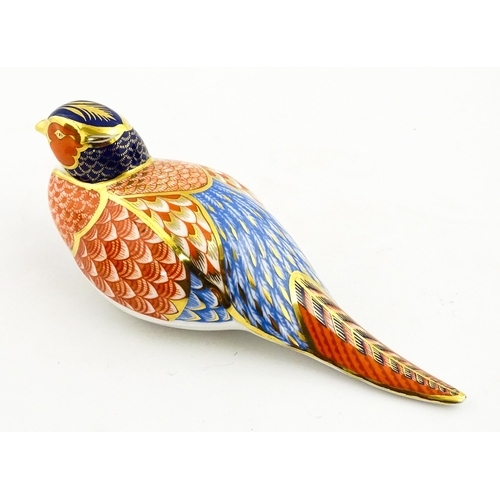 148 - A Royal Crown Derby paperweight modelled as a pheasant. Marked under, with gold stopper. Boxed. Appr... 