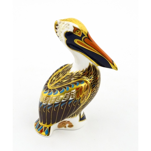 149 - A Royal Crown Derby limited edition Hadleigh paperweight modelled as a Brown Pelican, designed by Jo... 