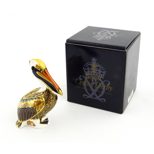 149 - A Royal Crown Derby limited edition Hadleigh paperweight modelled as a Brown Pelican, designed by Jo... 