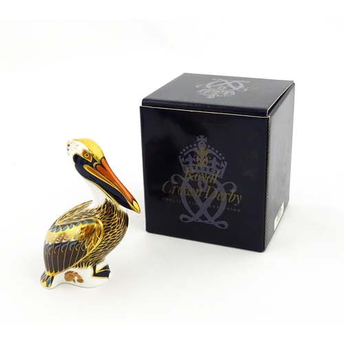 149 - A Royal Crown Derby limited edition Hadleigh paperweight modelled as a Brown Pelican, designed by Jo... 