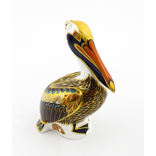 149 - A Royal Crown Derby limited edition Hadleigh paperweight modelled as a Brown Pelican, designed by Jo... 