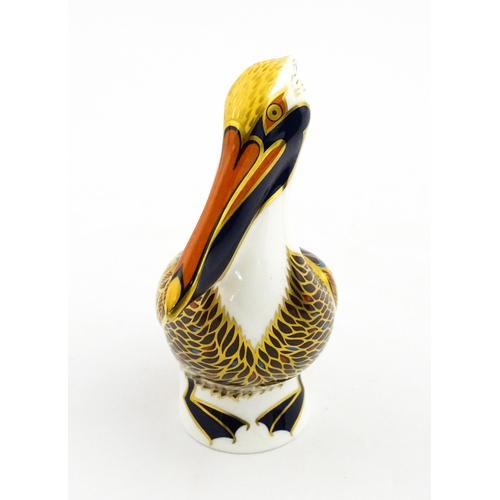 149 - A Royal Crown Derby limited edition Hadleigh paperweight modelled as a Brown Pelican, designed by Jo... 