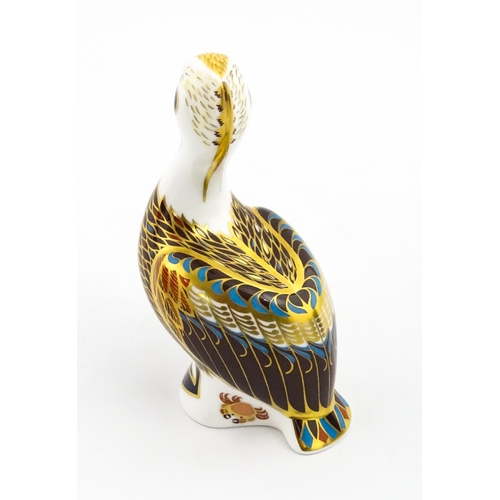 149 - A Royal Crown Derby limited edition Hadleigh paperweight modelled as a Brown Pelican, designed by Jo... 