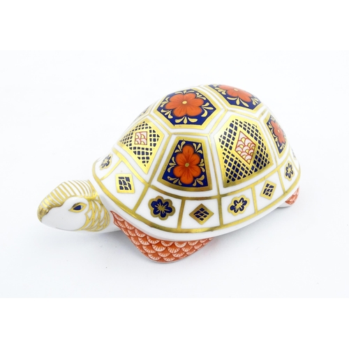 151 - A Royal Crown Derby paperweight modelled as a tortoise. Marked under, with gold stopper. Approx. 4 1... 